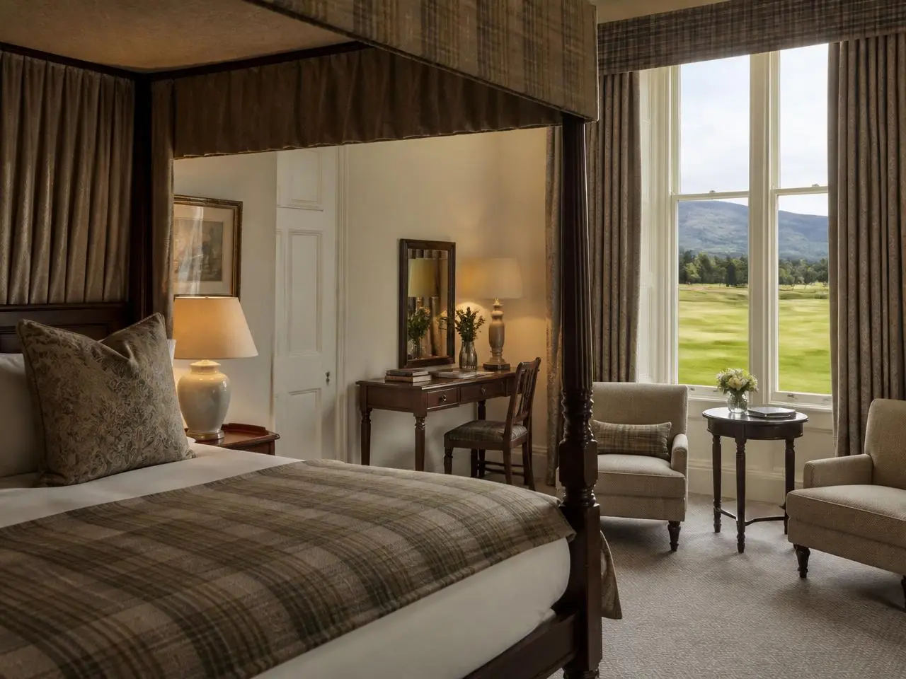 Estate suite bedroom with four-poster bed and golf course view